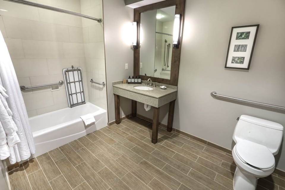 Clean and spacious bathroom with modern amenities, offering comfort and convenience.