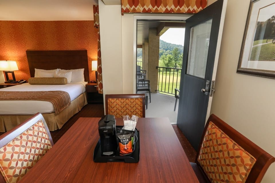 Elegant room with a comfortable bed and direct access to a private outdoor patio.