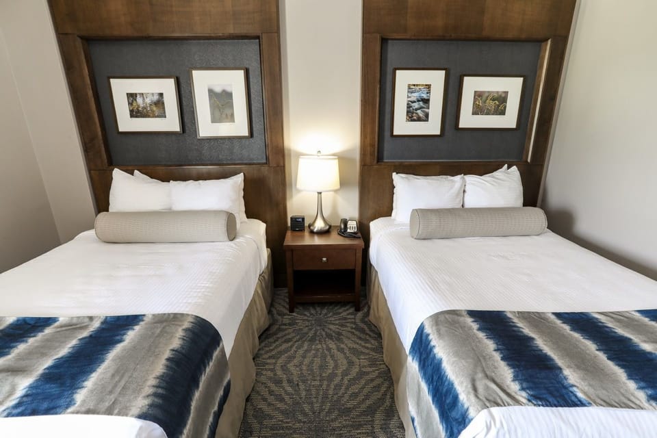 Comfortable room with two cozy beds and modern décor, perfect for a relaxing stay.