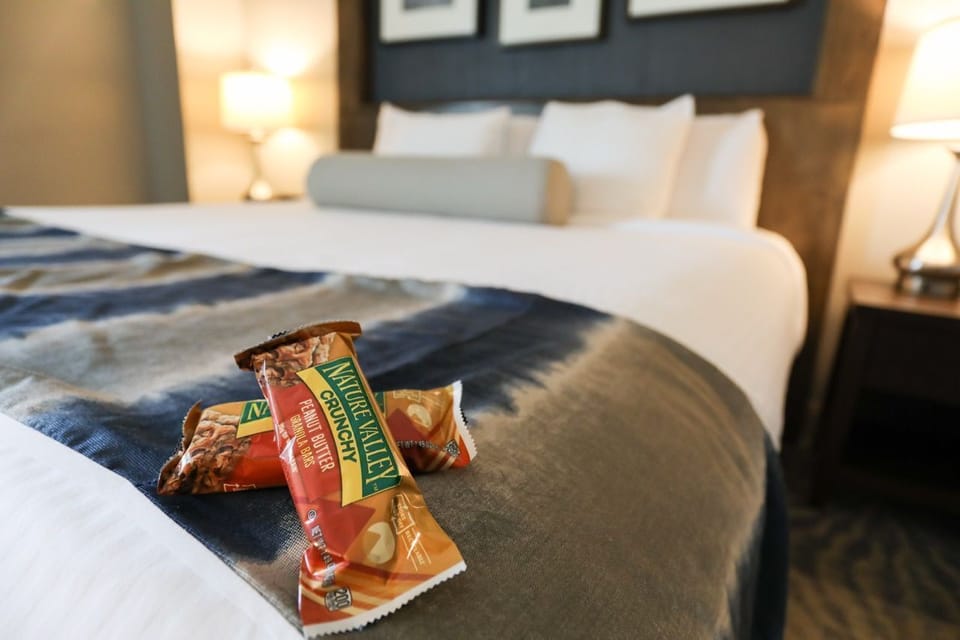 A warm welcome awaits with thoughtful touches and a cozy, inviting bed.