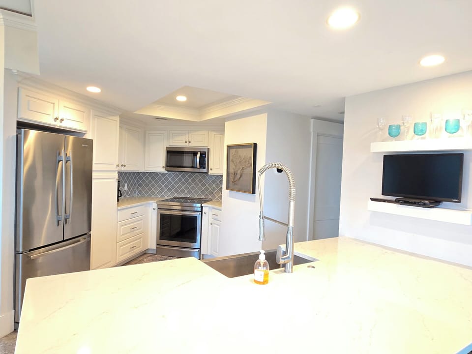 New kitchen smart tv.  Watch tv as you cook a delicious seafood meal.