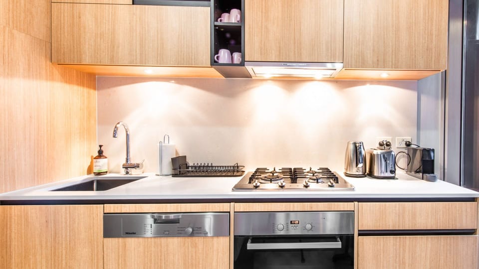 Cook with ease utilizing premium stainless steel appliances, seamless gas cooking, and rich timber finishes.