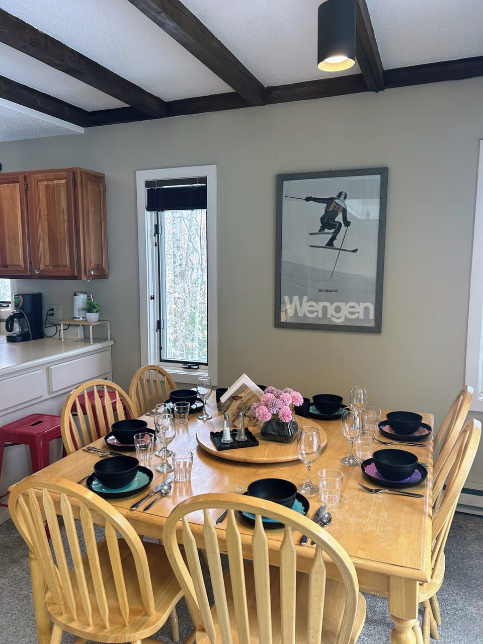 Dining table with seating for eight, plus two breakfast-ledge stools