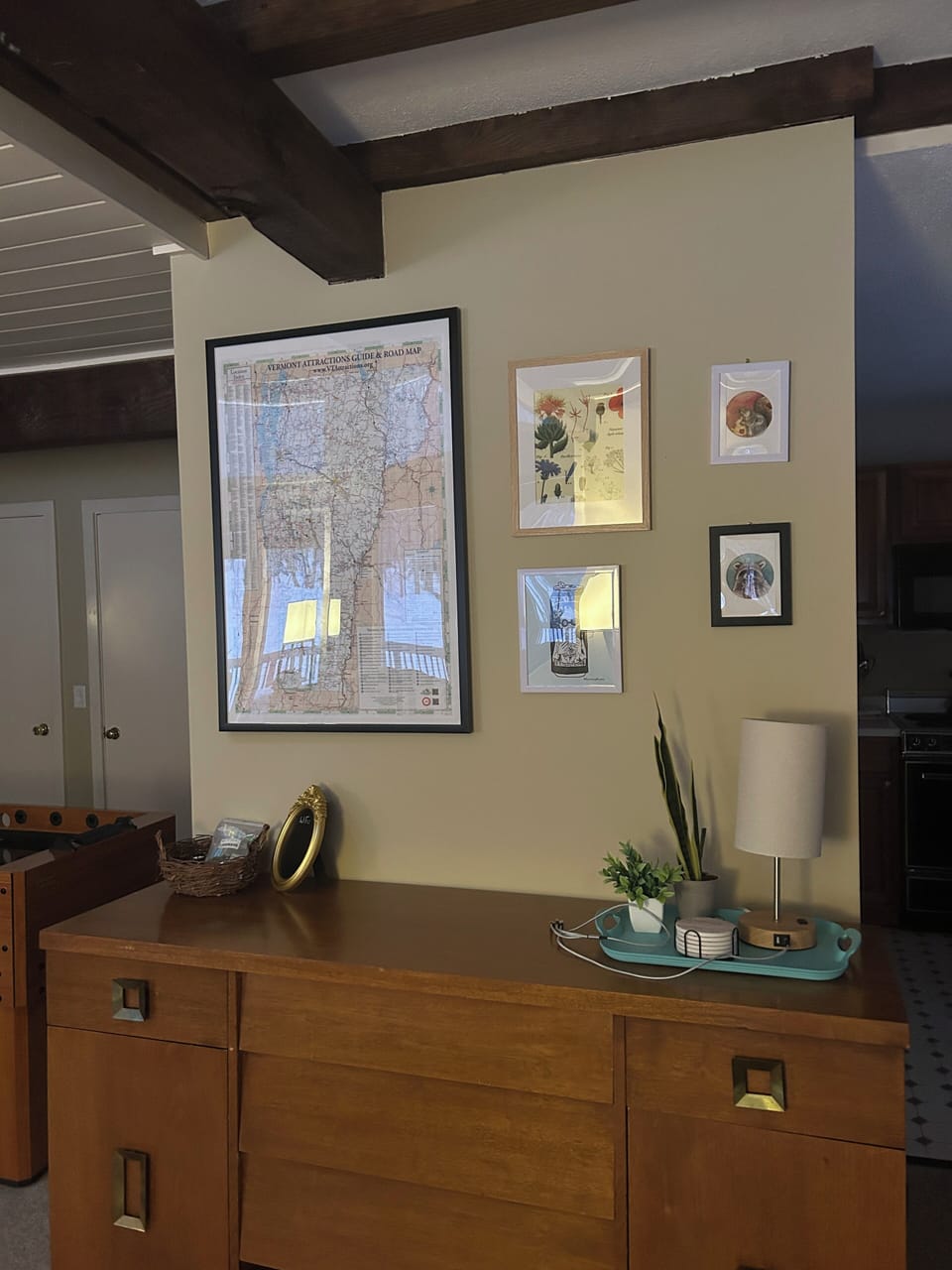 Living room hutch full of office supplies, decks of cards, and party supplies