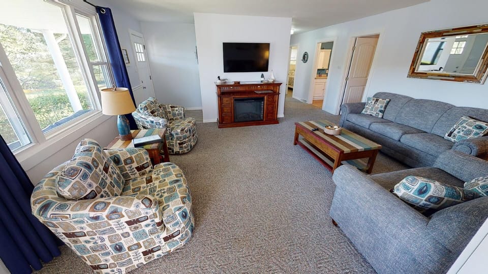 Spacious king bedroom with stunning lake views for a serene retreat.