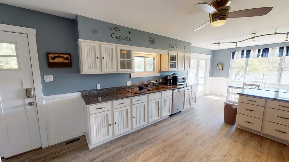 Spacious countertops, ample cabinets, and a large island for functionality.