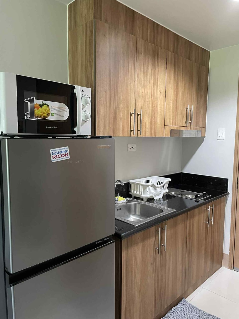 Kitchen area. Refrigerator & microwave available for preserving and heating food