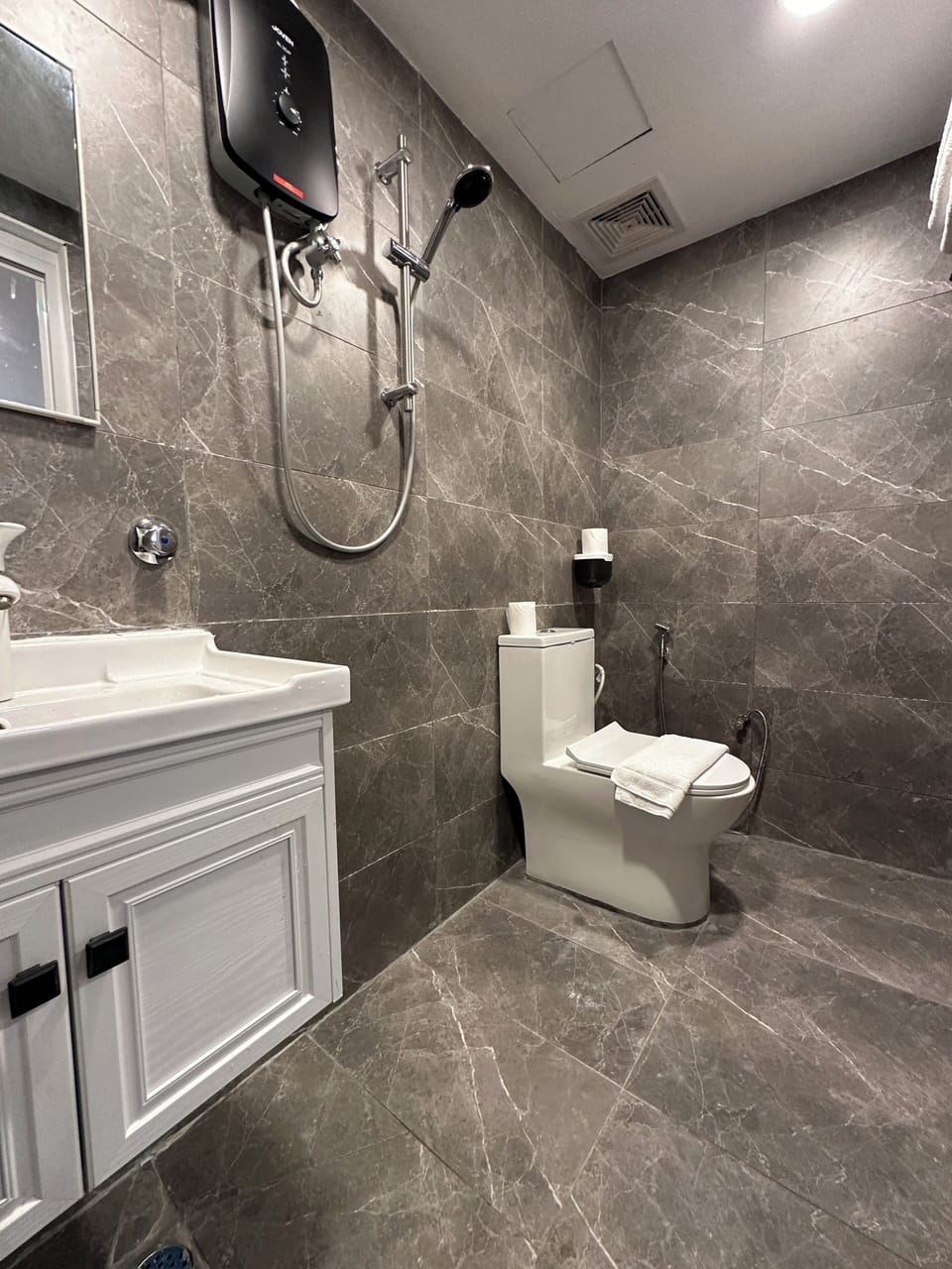 Shower, free toiletries, hair dryer, slippers