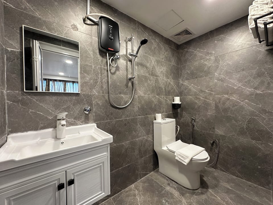 Shower, free toiletries, hair dryer, slippers