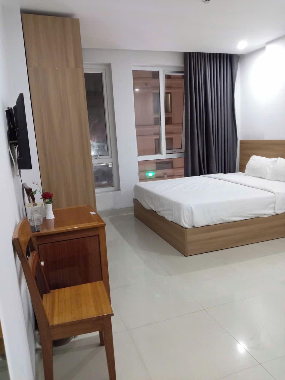 Deluxe Quadruple Room, City View | Hypo-allergenic bedding available, minibar (some free items), desk