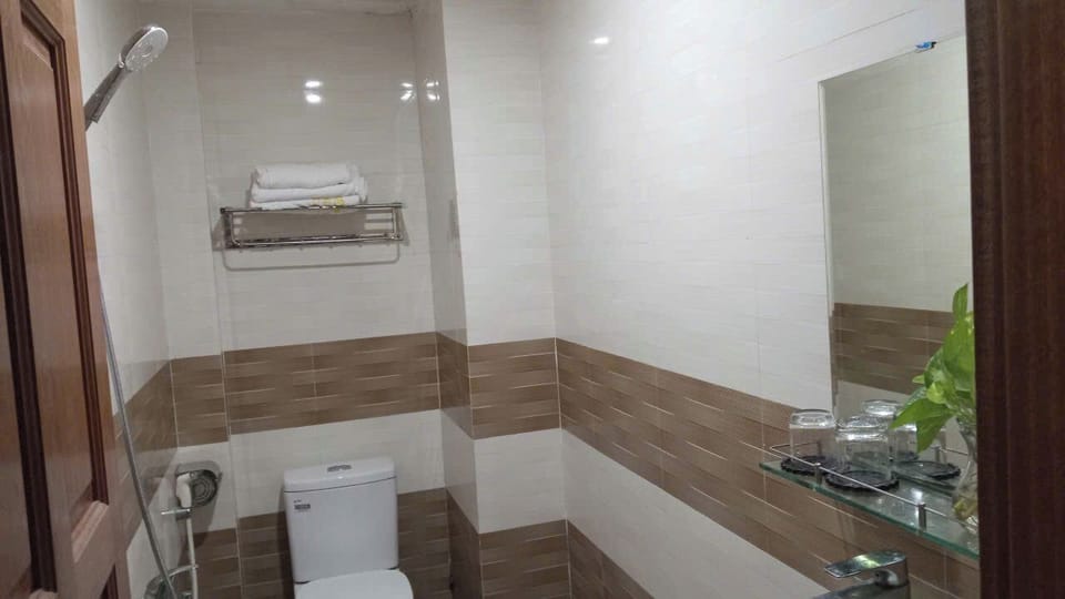 Shower, rainfall showerhead, designer toiletries, hair dryer