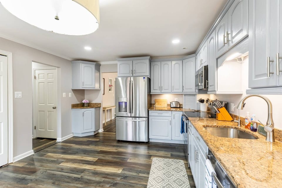 The kitchen is conveniently located across from the dining room.