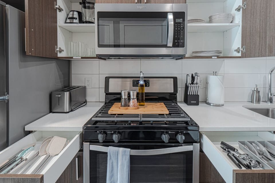Fully stocked kitchen with stainless steel appliances