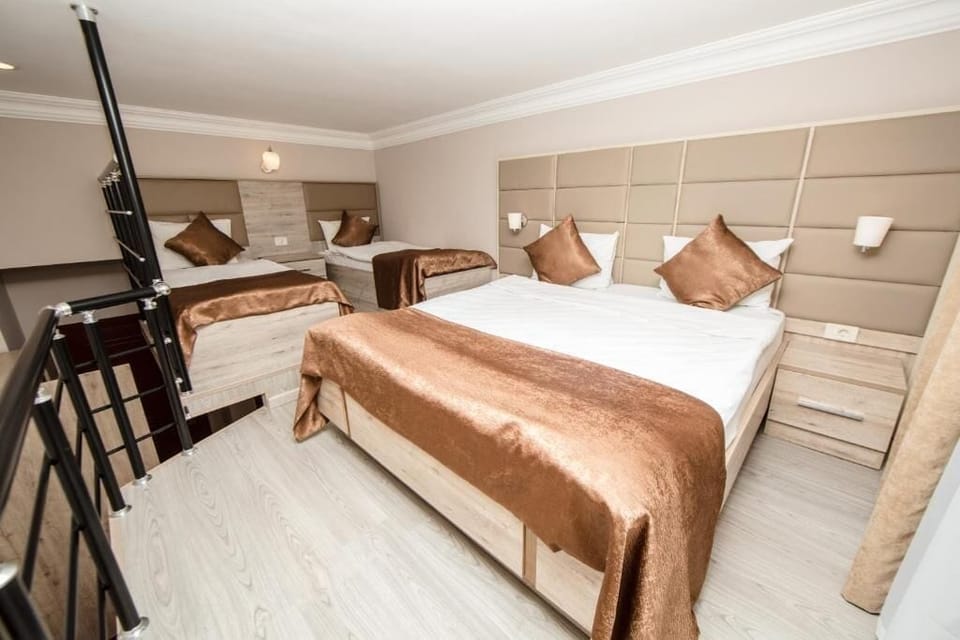 Family Duplex, Balcony, City View | Premium bedding, minibar, in-room safe, desk