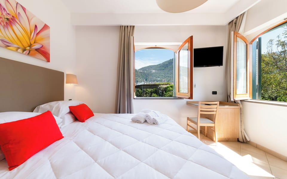 Comfort Triple Room, Garden View | In-room safe, blackout drapes, soundproofing, iron/ironing board