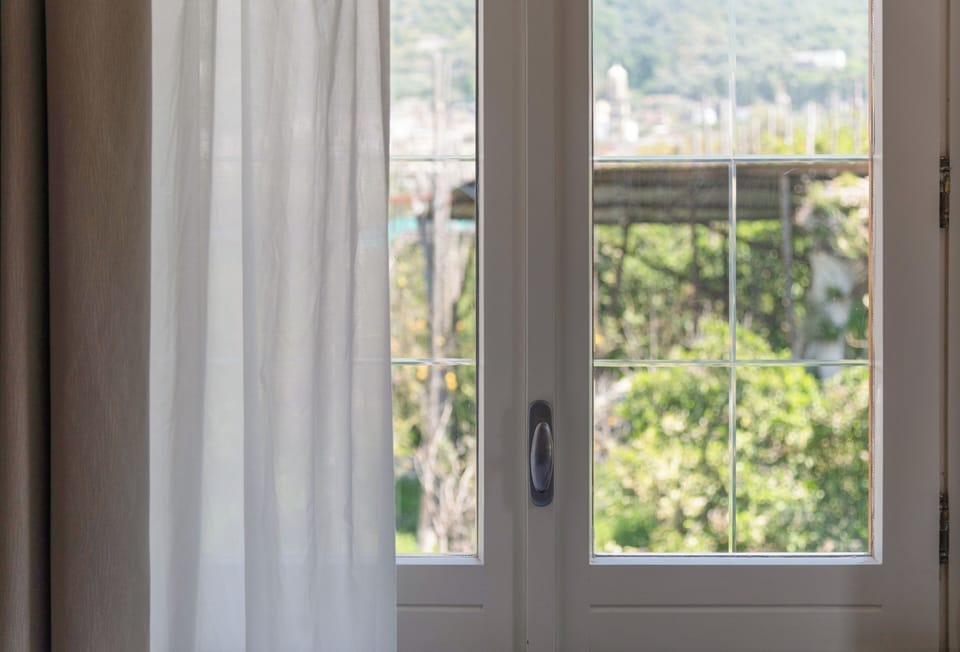 Comfort Triple Room, Garden View | In-room safe, blackout drapes, soundproofing, iron/ironing board