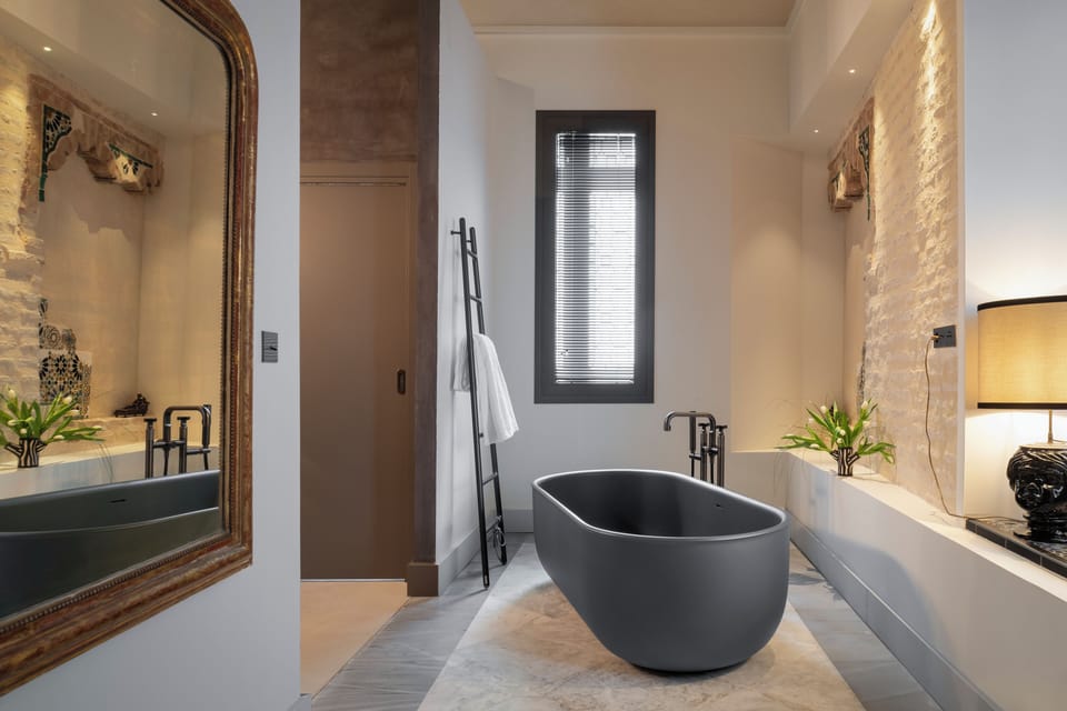 Junior Suite, Bathtub | Bathroom | Hair dryer, bathrobes, slippers, heated floors