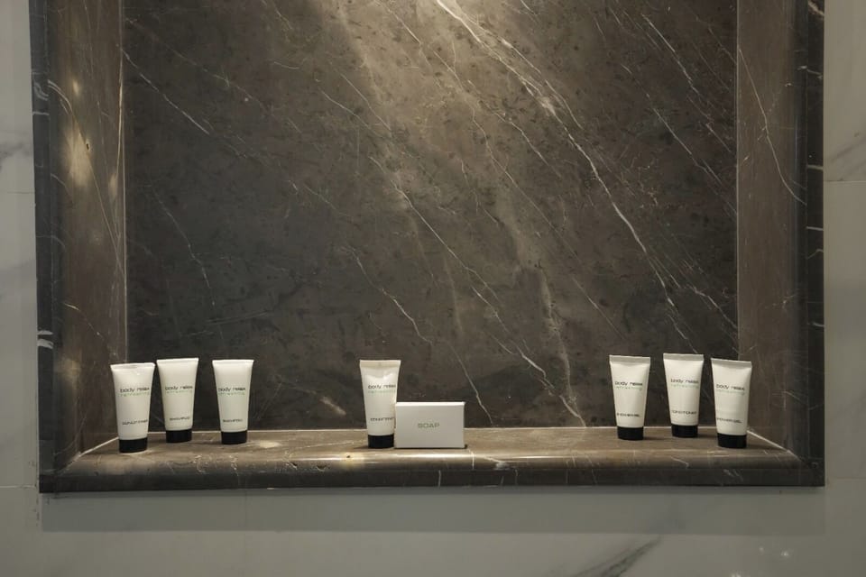 Combined shower/tub, hair dryer, towels, soap