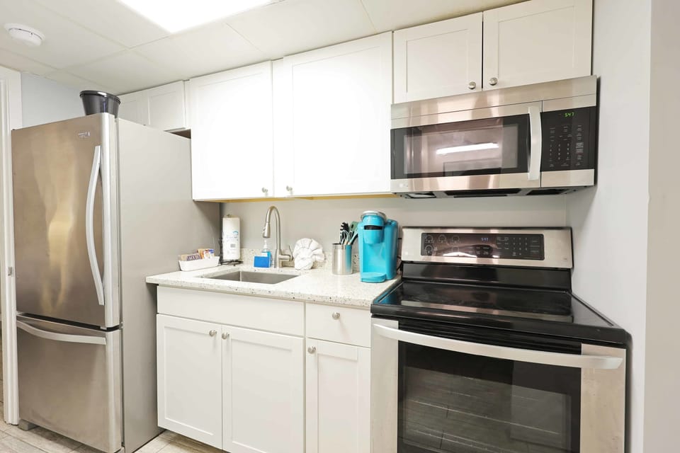 Enjoy the convenience of a fully equipped kitchen featuring stainless steel appliances, granite countertops, and a Keurig coffee maker—perfect for preparing meals or beach snacks during your Myrtle Beach getaway!