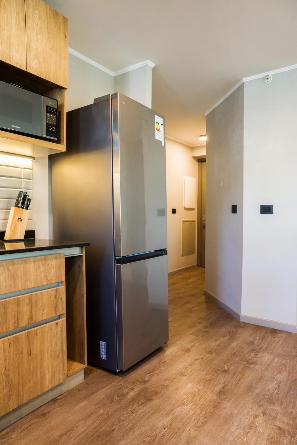 Modern kitchen with sleek appliances and ample storage, ideal for culinary enthusiasts.