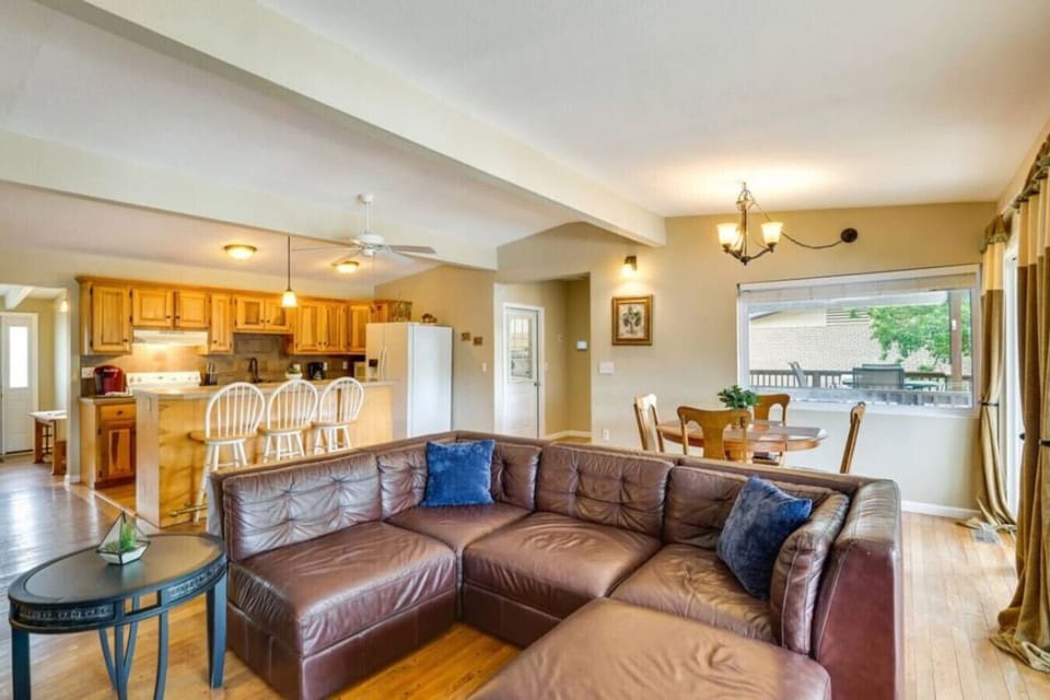 Open-concept living and dining space with warm wooden accents and cozy furnishings, creating a welcoming retreat.