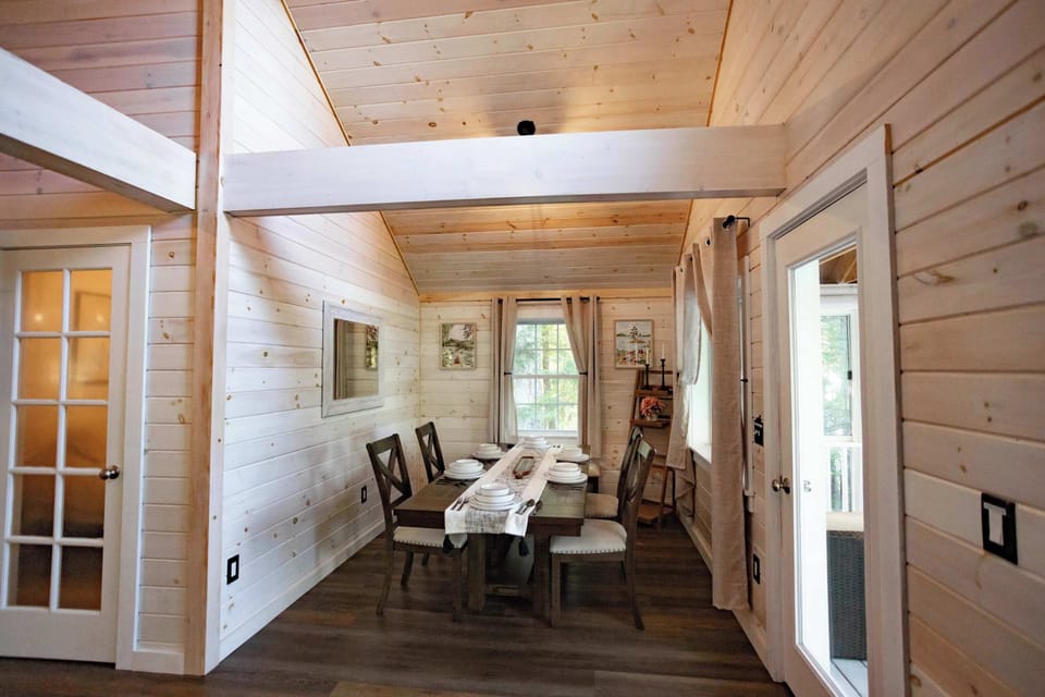 Dedicated dining area with seating for group meals and easy access to the deck.