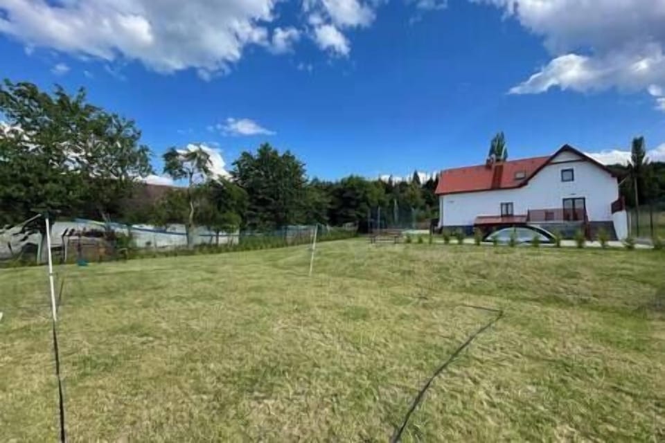 Garden with playground and swimming pool