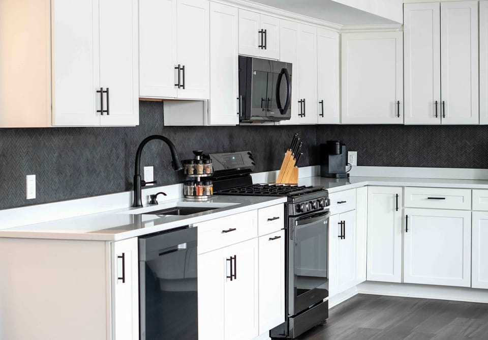 The chic, open kitchen offers ample space & every home comfort
