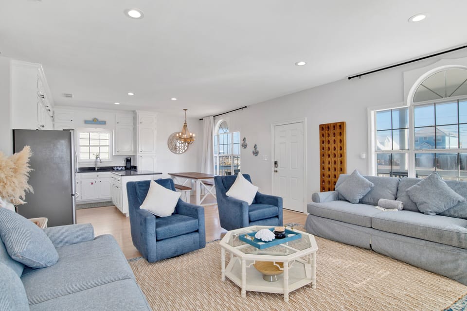 The living room has a sleeper sofa and TV