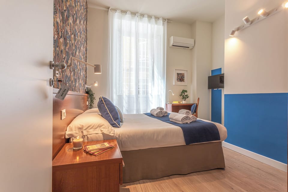 Room (Palma Suite) | Desk, laptop workspace, blackout drapes, free WiFi