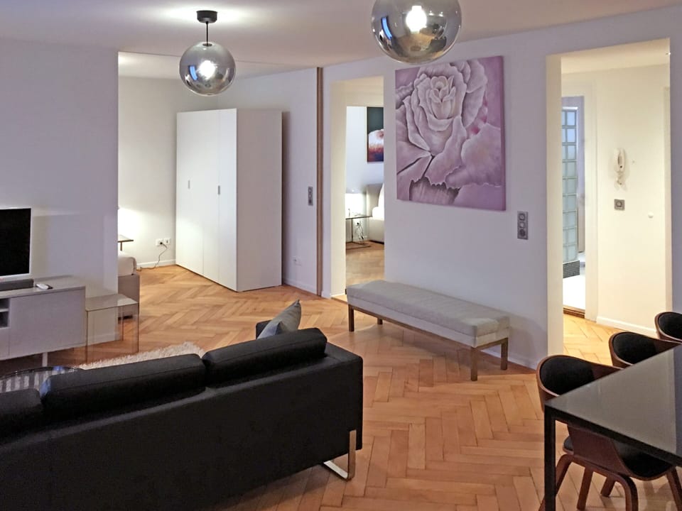 Deluxe Apartment, 2 Bedrooms, Balcony | Living area | 32-inch flat-screen TV with cable channels