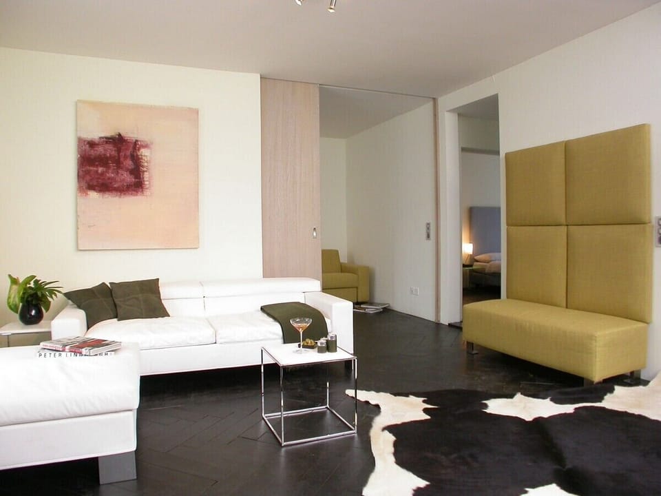 Senior Apartment, 2 Bedrooms, Balcony | Living area | 32-inch flat-screen TV with cable channels