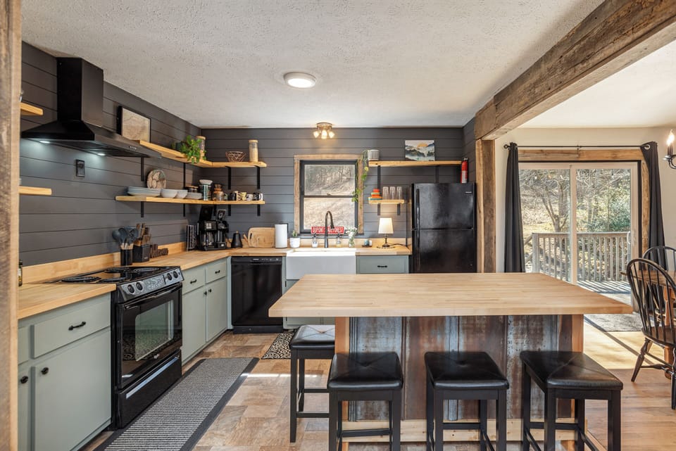 Fully stocked kitchen with custom kitchen island of reclaimed local wood