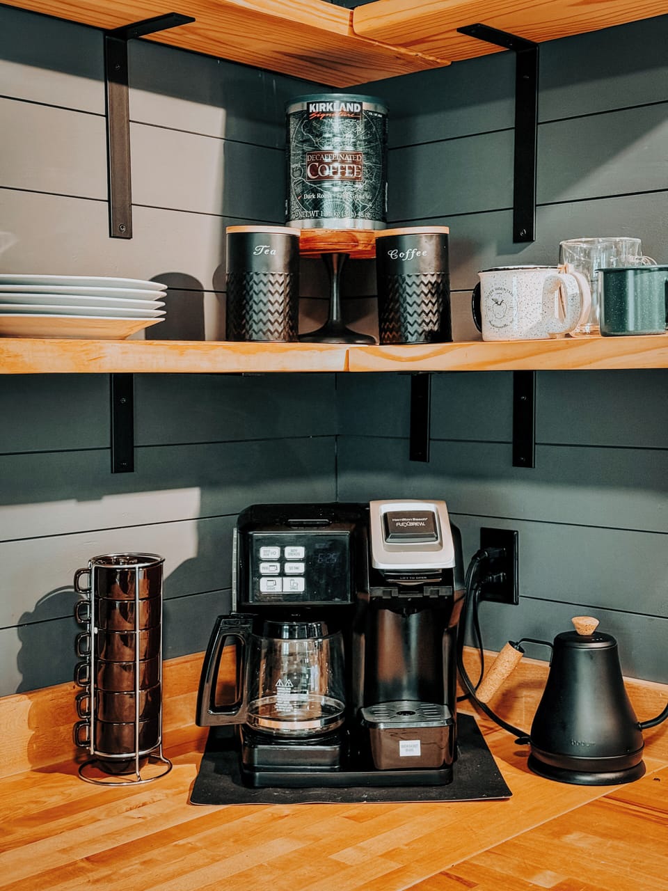 Stocked coffee bar complete with pour over option and instant tea kettle.