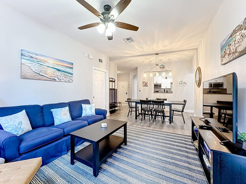 Comfortable living area featuring a smart TV, showcasing the dining space as well.