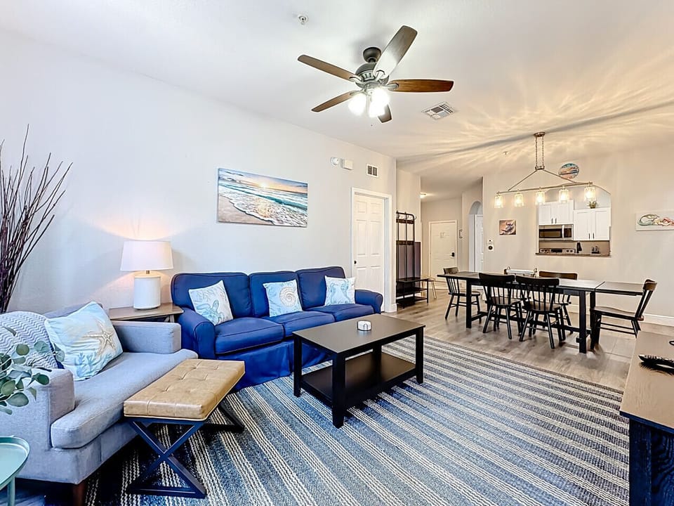Comfortable living area featuring a smart TV, showcasing the dining space as well.