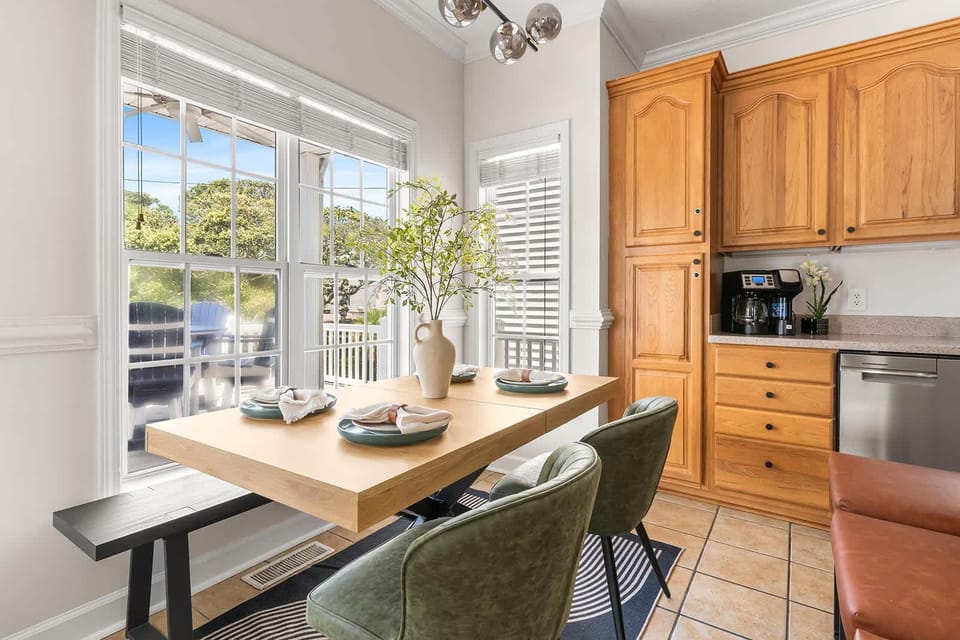 Bright dining nook with garden views and cozy seating