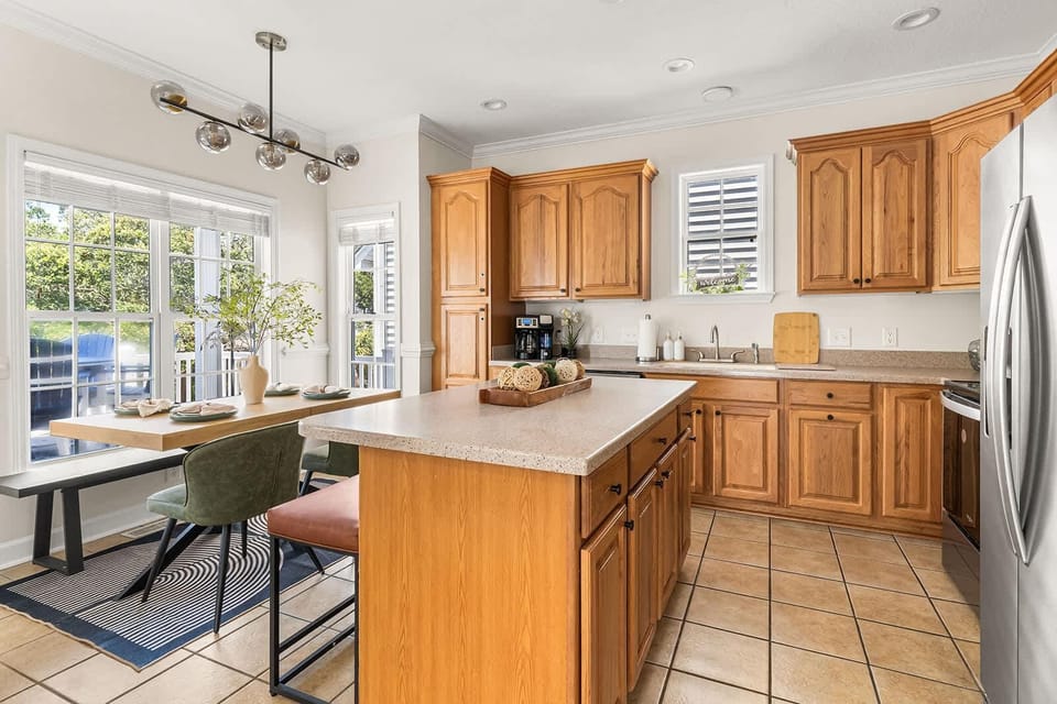 Sunlit kitchen and dining area with garden views