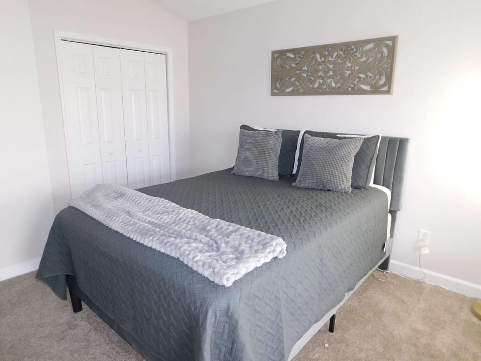 Cozy bedroom retreat with plush bedding and serene decor