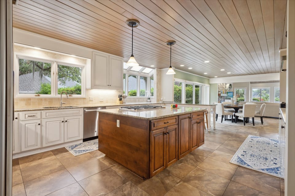 The open layout, cozy bar stools, and scenic views invite slow mornings with coffee and laughter-filled evenings.