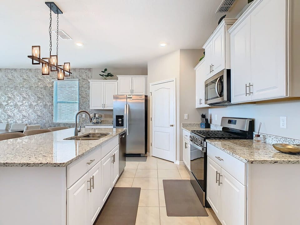 Spacious kitchen with counter seating.