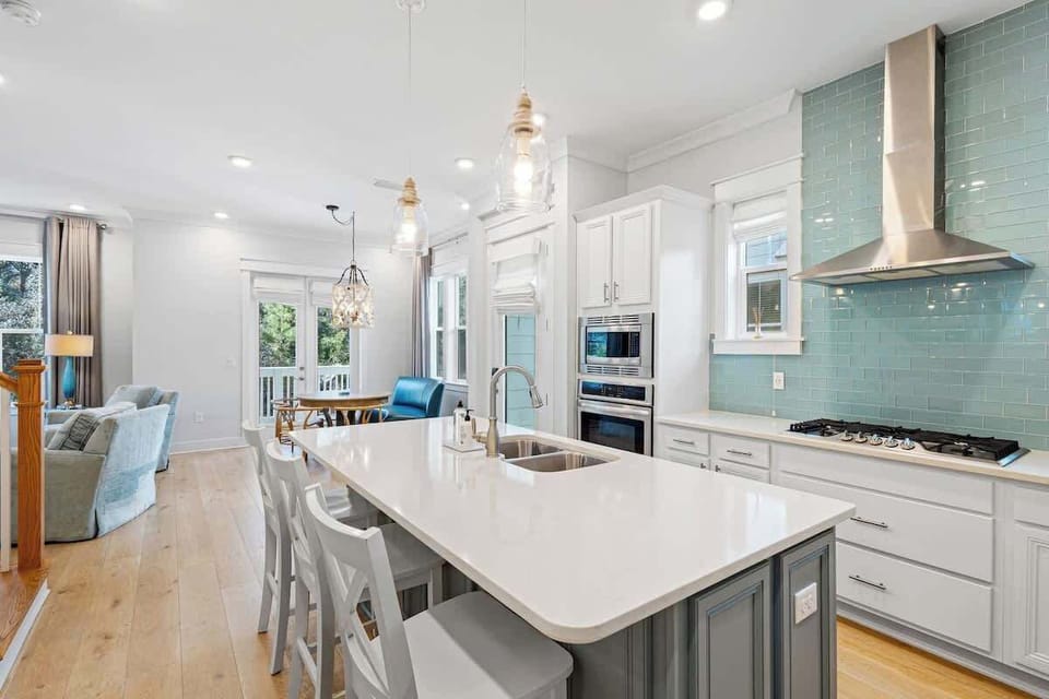 Large kitchen island includes 3 additional seats.