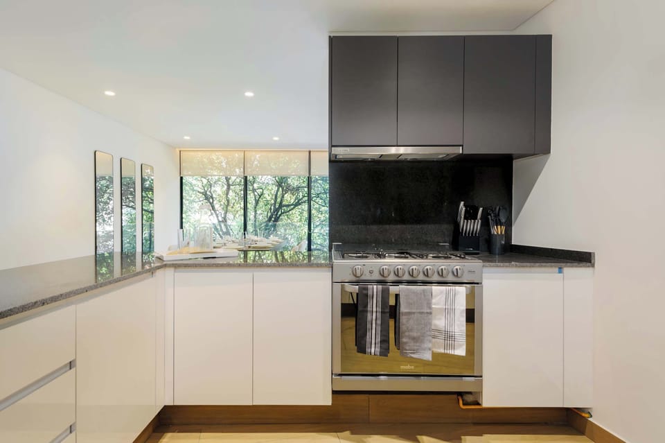 Kitchen equipped with oven and stove