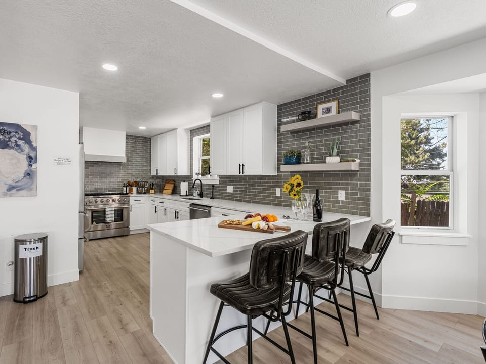 Full chef-grade kitchen with seating. Include cookware, utensils, pots/pans