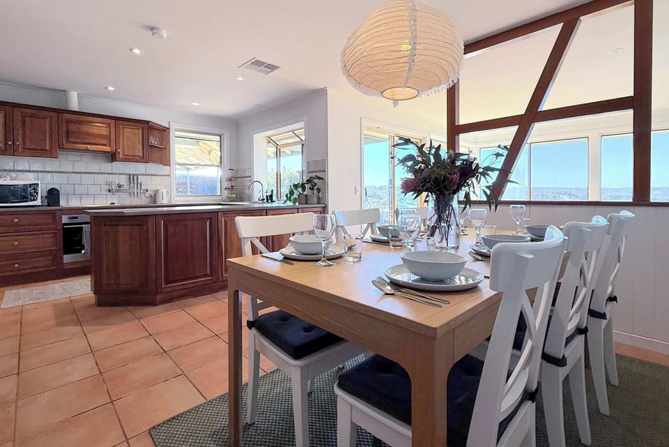 Spacious open plan kitchen with dining area for 6 people.
