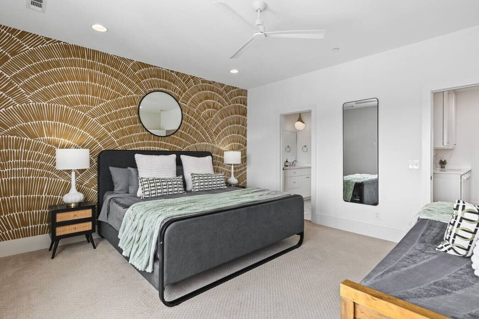 Bedroom #5 on the top floor with a King bed, Twin bed, Smart TV, large ensuite bathroom, and huge walk-in closet.