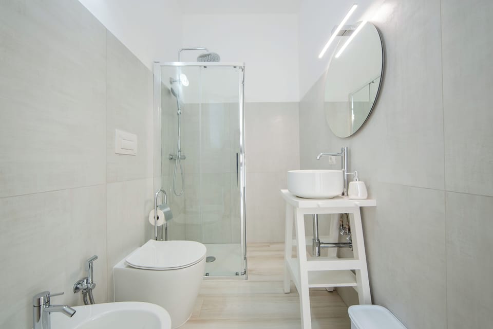 Family Room, Balcony, City View | Bathroom | Shower, hair dryer, slippers, towels