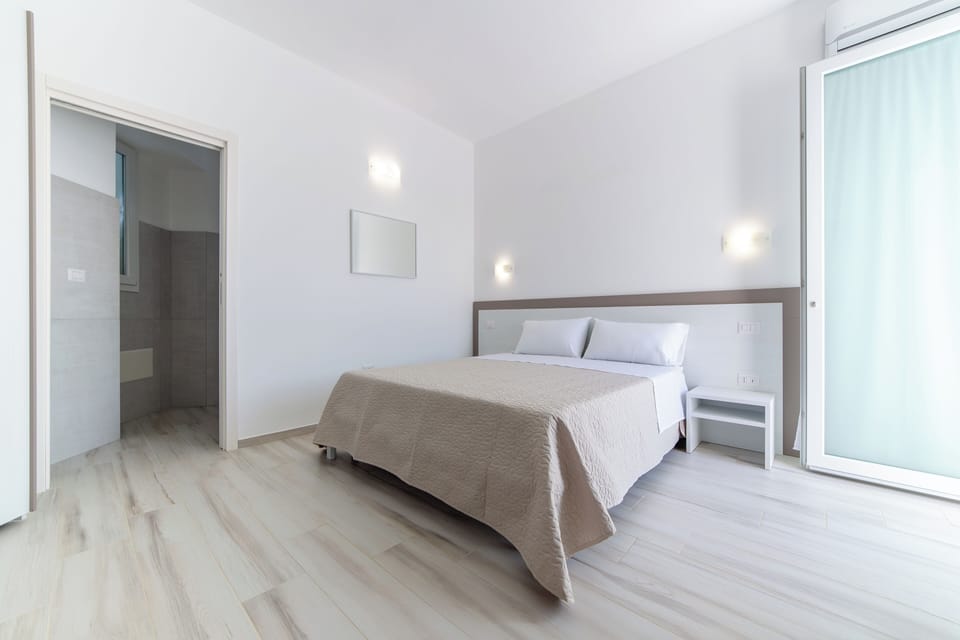 Family Room, Balcony, City View | In-room safe, soundproofing, free WiFi