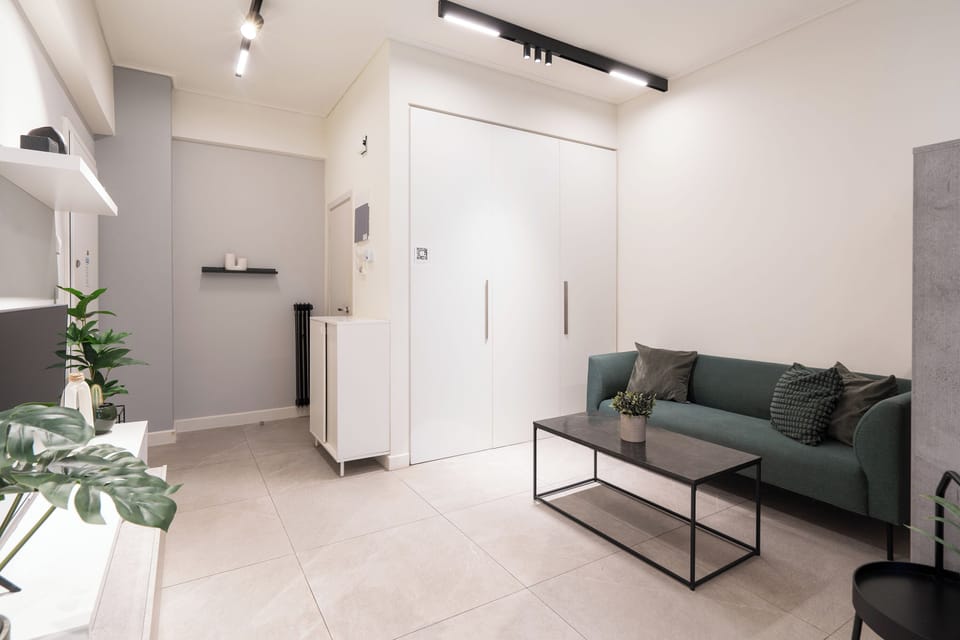 Luxury Studio Suite, Balcony | Living room | 42-inch TV with cable channels