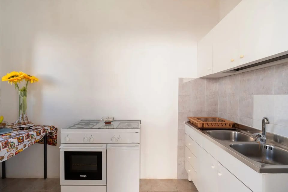 Villa, Patio | Private kitchen | Oven, stovetop, cookware/dishes/utensils, dining tables